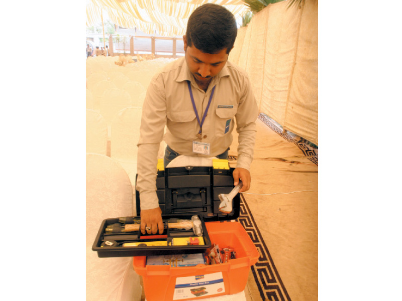 waqas pervaiz who was awarded the best of the batch certificate examines the tool kit he received as a prize during the 2nd graduation ceremony of hunar foundation at its dms technical institute on saturday photo athar khan express