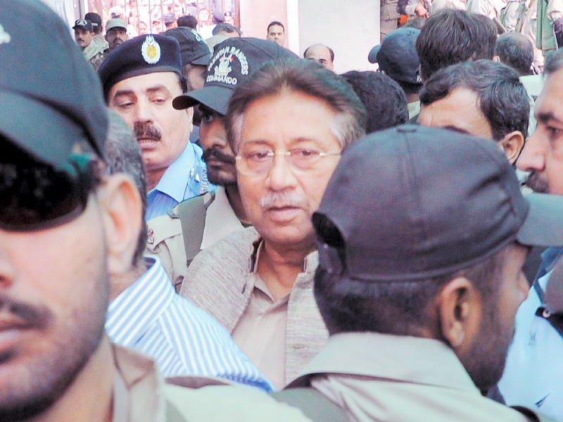 pervez musharraf escorted by security officials as he leaves the anti terrorism court photo muhammad javaid express