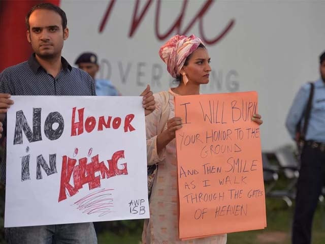 pakistani civil society activists carry placards during a protest in islamabad on july 18 2016 against the murder of social media celebrity qandeel baloch by her own brother photo getty