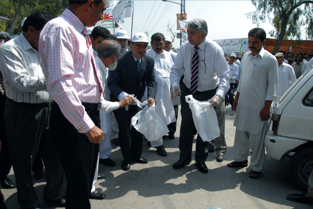 the drive titled clean and green islamabad was kick started by the cda chairperson by symbolically collecting garbage in sector i 10 photo zafar aslam