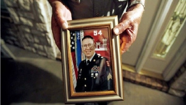 wilburn russell 73 displays a portrait of his son sergeant john m russell the army sergeant who is accused of killing five fellow soldiers in iraq outside of his son 039 s home in sherman texas photo reuters wilburn russell 73 displays a portrait of his son sergeant john m russell the army sergeant who is accused of killing five fellow soldiers in iraq outside of his son 039 s home in sherman texas photo reuters