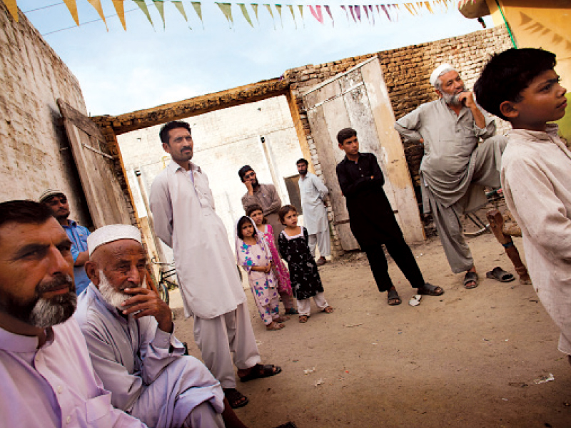 locals discuss the merits or lack thereof of female voting mechanism in charsadda photo myra iqbal expess