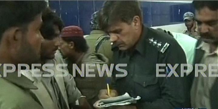 a screengrab shows a police official taking down information from eyewitnesses at the hospital in quetta screengrab express news