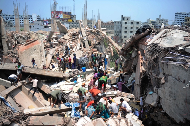 bangladeshi civiliant volunteers assist in rescue operations after an eight storey building collapsed in savar photo afp