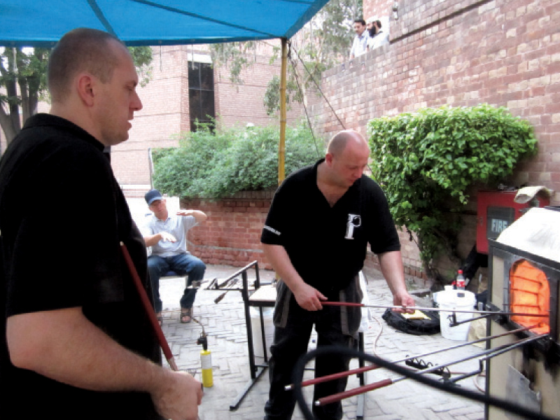 the mobile workshop has a work bench and two ovens  one to heat the glass and other to cool it slowly