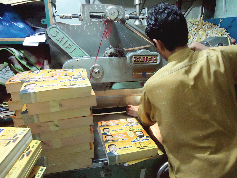 muhammad sajjad works late in islambabad to meet the soaring demands for printing photo riazul haq