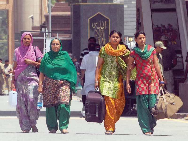 sarabjit singh s wife daughters and his sister walk after crossing the wagah border photo afp