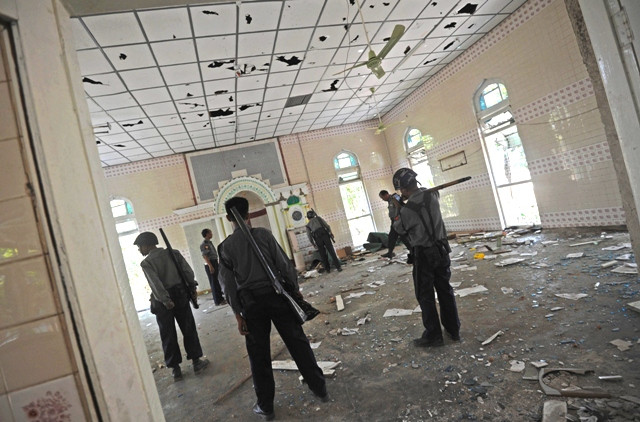myanmar police inspect a damages mosque at a village near oakkan town photo afp
