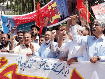 may day ruling elite blamed for workers woes