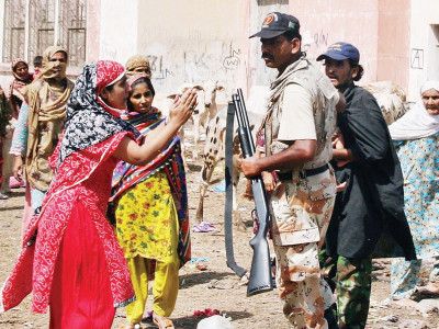 bringing in the force land dispute leaves nine shops vehicles ablaze