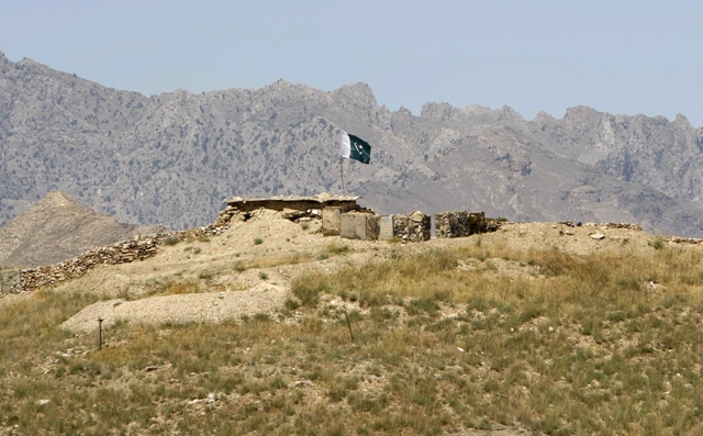 a pakistani flag flies on top of a pakistani check post at the goshta district of nangarhar province where afghanistan shares borders with pakistan photo reuters