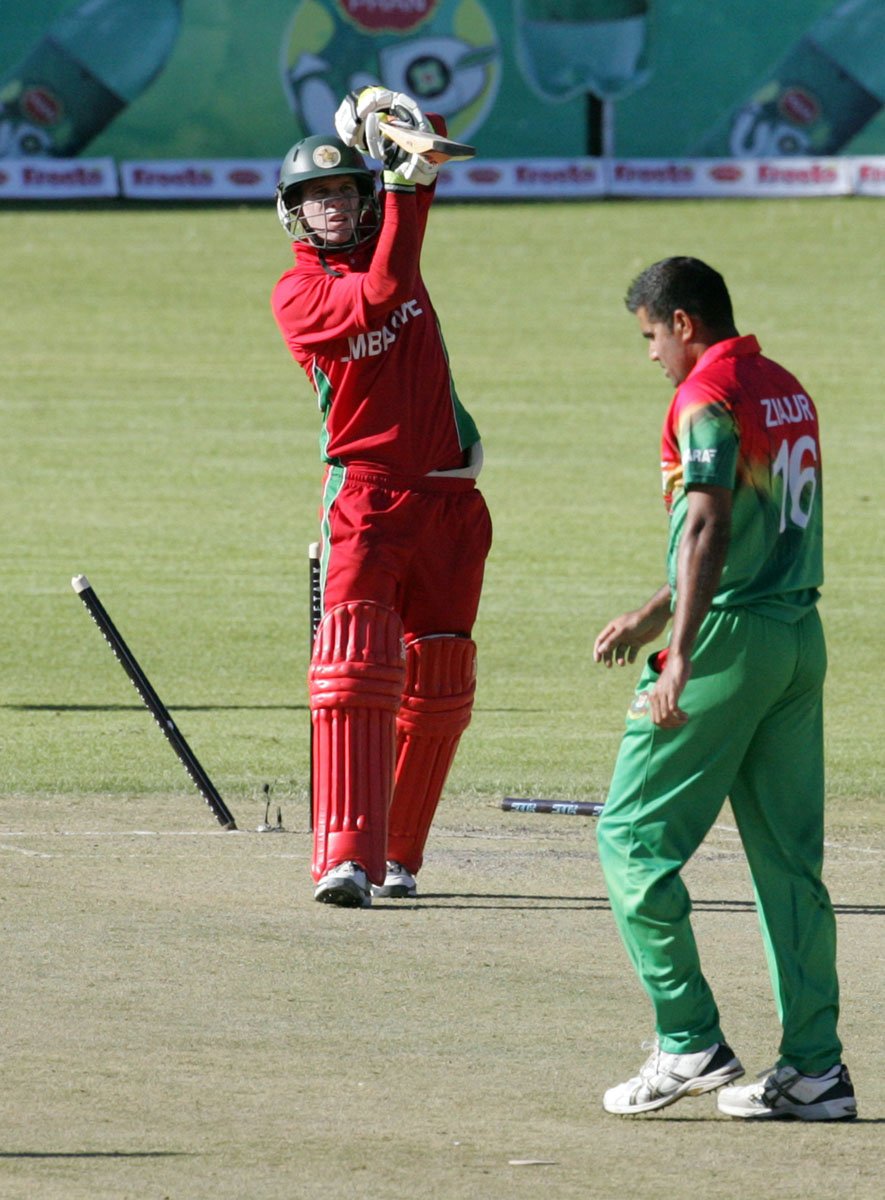 zimbabwean batsman malcolm waller l looses his wicket to bangladeshi bowler ziaur rahman on may 3 2013 at the queens sports club in bulawayo zimbabwe photo afp