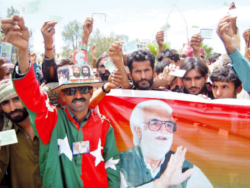 protesters hold up their banners and show their cnics photo muhammad javaid express