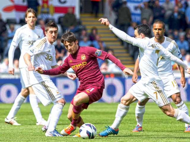 second placed city drew 0 0 at swansea who had more chances to win the game yesteday photo afp second placed city drew 0 0 at swansea who had more chances to win the game yesteday photo afp
