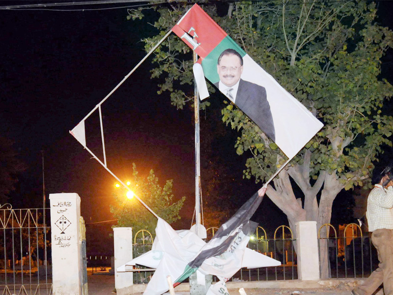mqm hoardings damaged by the blasts in azizabad photo mohammad noman express