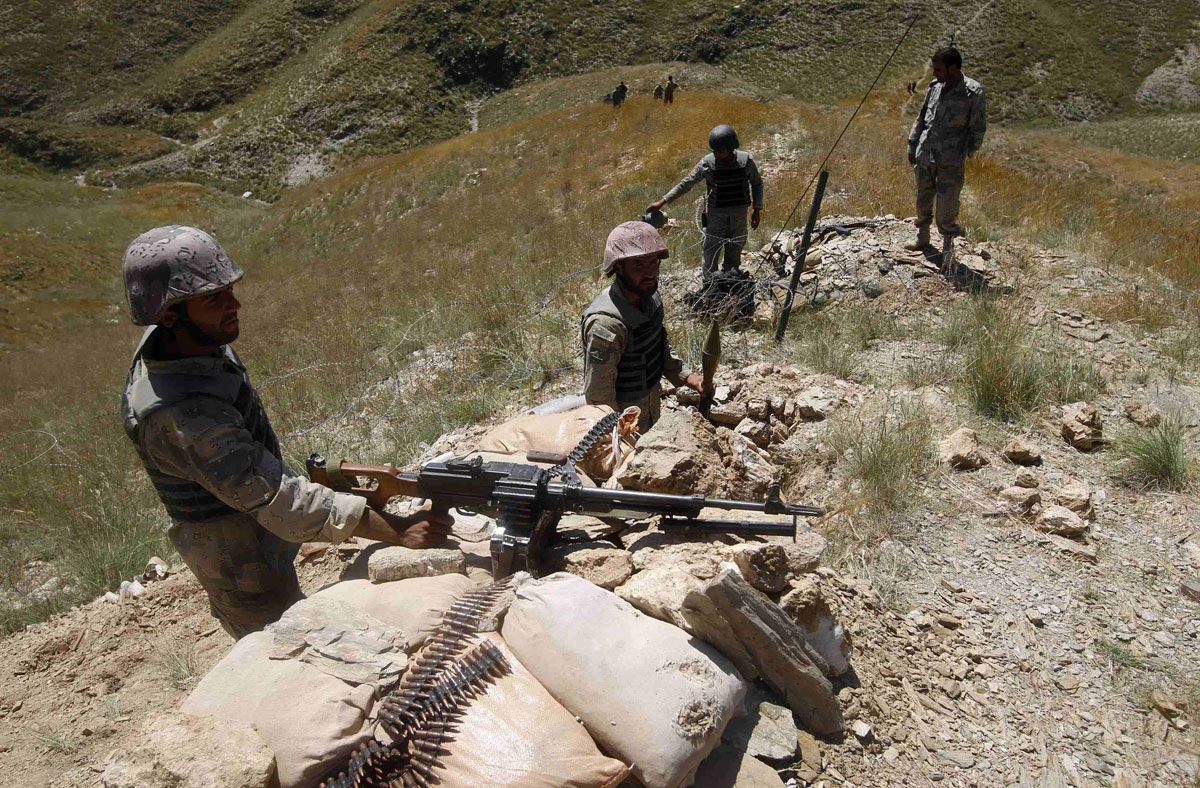 afghan border policemen take their positions at the goshta district of nangarhar province border where afghanistan shares borders with pakistan may 2 2013 photo reuters