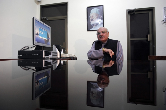 mian iftikhar hussain of the awami national party and candidate for the upcoming elections sits at his desk during an interview with reuters at his party office in peshawar may 1 2013 photo reuters