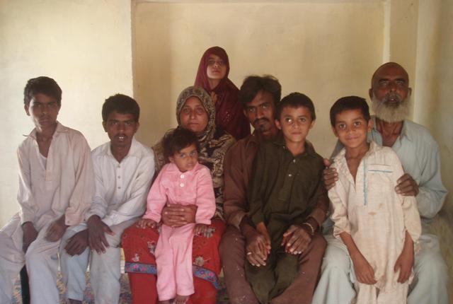 imran second from the right a victim of child trafficking poses with his family in rahim yar khan photo zahid gishkori express tribune