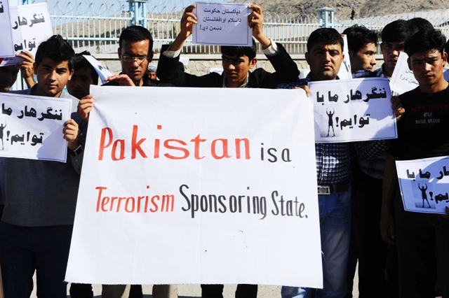 afghan protesters hold placard as they shout slogans during a demonstration against pakistan in herat may 8 2013 photo afp