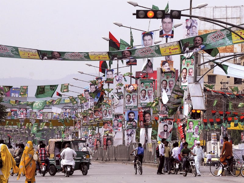 a view of the benazir bhutto road which has been adorned with flags and banners of different parties photo agha mehroz express