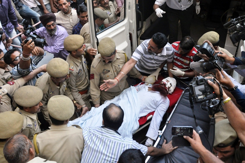 in this photograph taken on may 3 2013 pakistani prisoner sanaullah ranjay an inmate of india 039 s central jammu jail that was attacked by indian inmates at a prison is carried from a hospital to an ambulance in jammu before being transferred to a hospital in chandigarh for treatment photo afp file