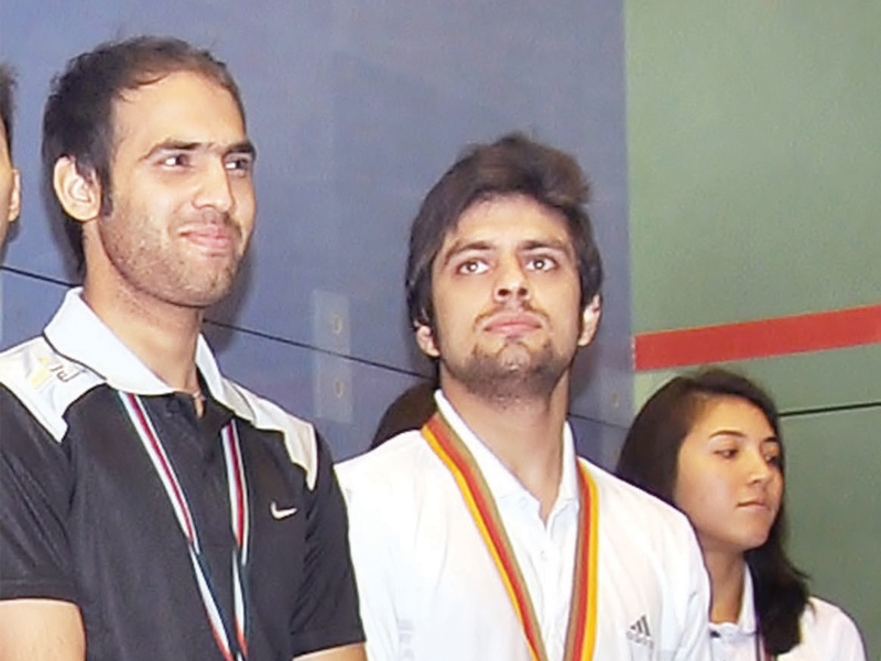 farhan and aamir feel the trials downplay their achievement at the asian individual squash championship photo file express