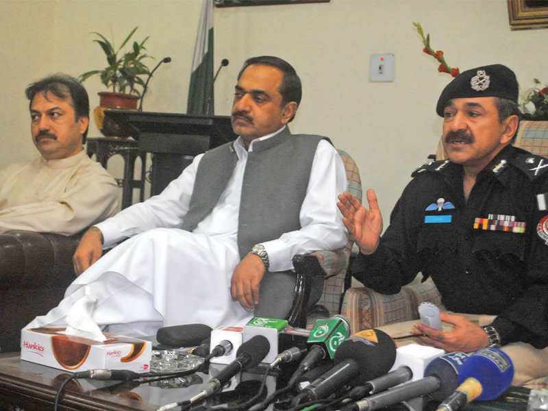 ccpo laiqat ali khan right along with commissioner sahibzada anees centre and deputy commissioner javed marwat left outline the security plan for election day in peshawar photo muhammad iqbal