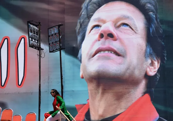 supporters of pakistani politician and former cricketer imran khan prepare a venue of an election campaign meeting photo afp file supporters of pakistani politician and former cricketer imran khan prepare a venue of an election campaign meeting photo afp file