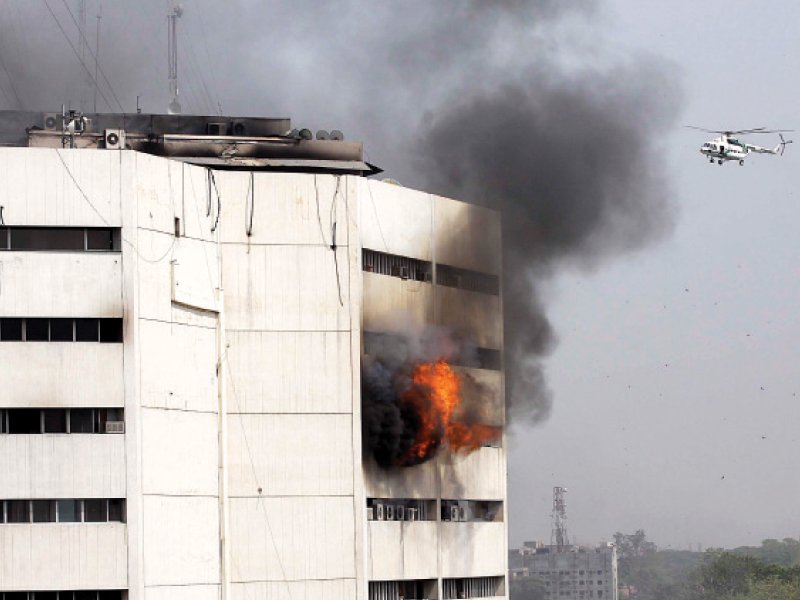 flames and smoke spew out from the seventh floor of the building photo shafiq malik abid nawaz express