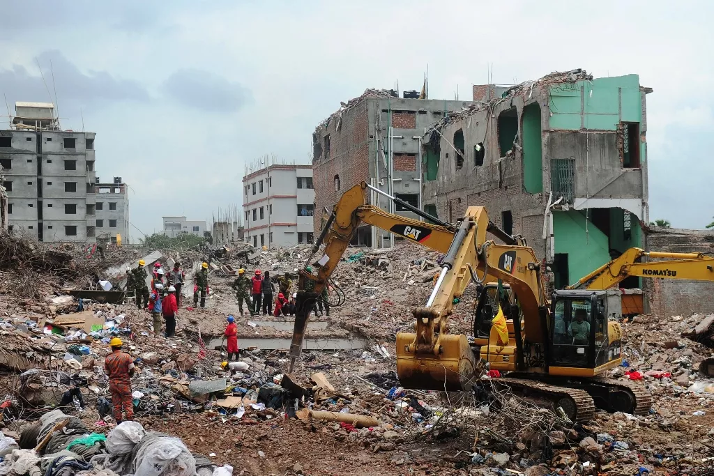 bangladeshi army personnel stand as they continue the second phase of the rescue operation using heavy equipment after an eight storey building collapsed in savar photo afp bangladeshi army personnel stand as they continue the second phase of the rescue operation using heavy equipment after an eight storey building collapsed in savar photo afp