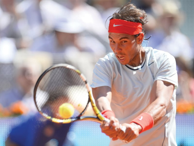rafael nadal battled back from a set and a break down to beat compatriot david ferrer to book a place in the semi finals of the madrid open photo afp