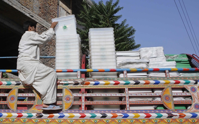 an election worker loads ballot boxes onto a truck before they are transported to polling areas photo reuters