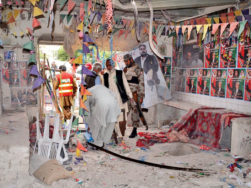 security personnel collect evidence from the site following the blast targeting a ppp election office in quetta photo online