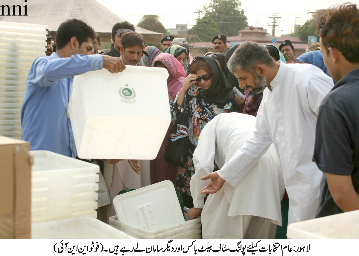 polling staff getting ready for polls photo nni