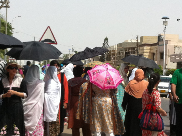 people stand in long queues as the polling process gets delayed in na 250 photo sarah munir people stand in long queues as the polling process gets delayed in na 250 photo sarah munir