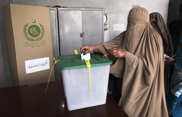 a woman casts her vote at a polling station on the outskirts of islamabad may 11 2013 photo reuters
