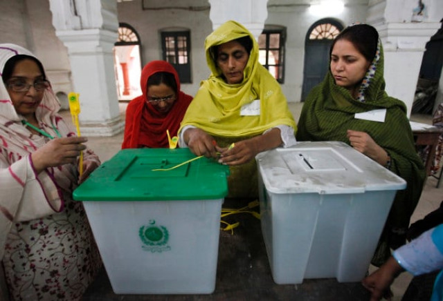 an election official seals a ballot box before the start of voting at a polling station in rawalpindi photo j0an0farc an election official seals a ballot box before the start of voting at a polling station in rawalpindi photo j0an0farc