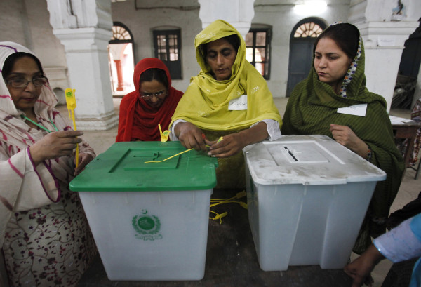 an election official seals a ballot box before the start of voting at a polling station in rawalpindi photo j0an0farc