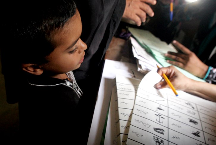 voters are enthusiastically taking part in general elections 2013 in faisalabad district photo athar khan express