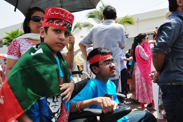 little tanzal a handicapped child in a wheelchair with his younger brother wore a pti cap and held a bat quot this is our dream we will vote quot said the eight year old little tanzal a handicapped child in a wheelchair with his younger brother wore a pti cap and held a bat quot this is our dream we will vote quot said the eight year old