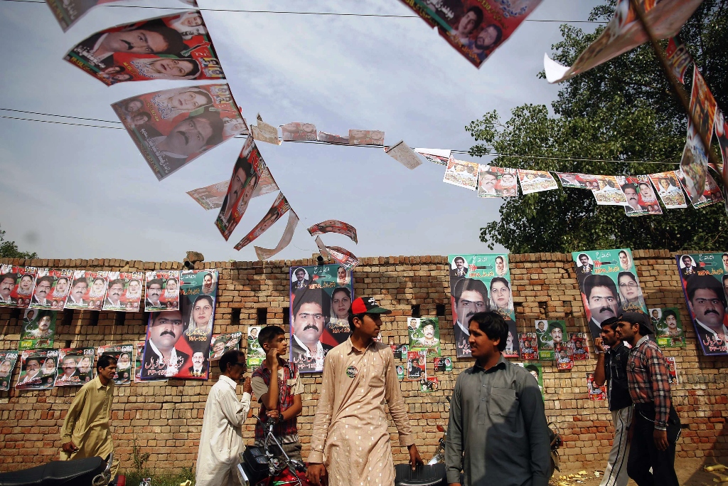 people gather near a polling station in a village photo reuters