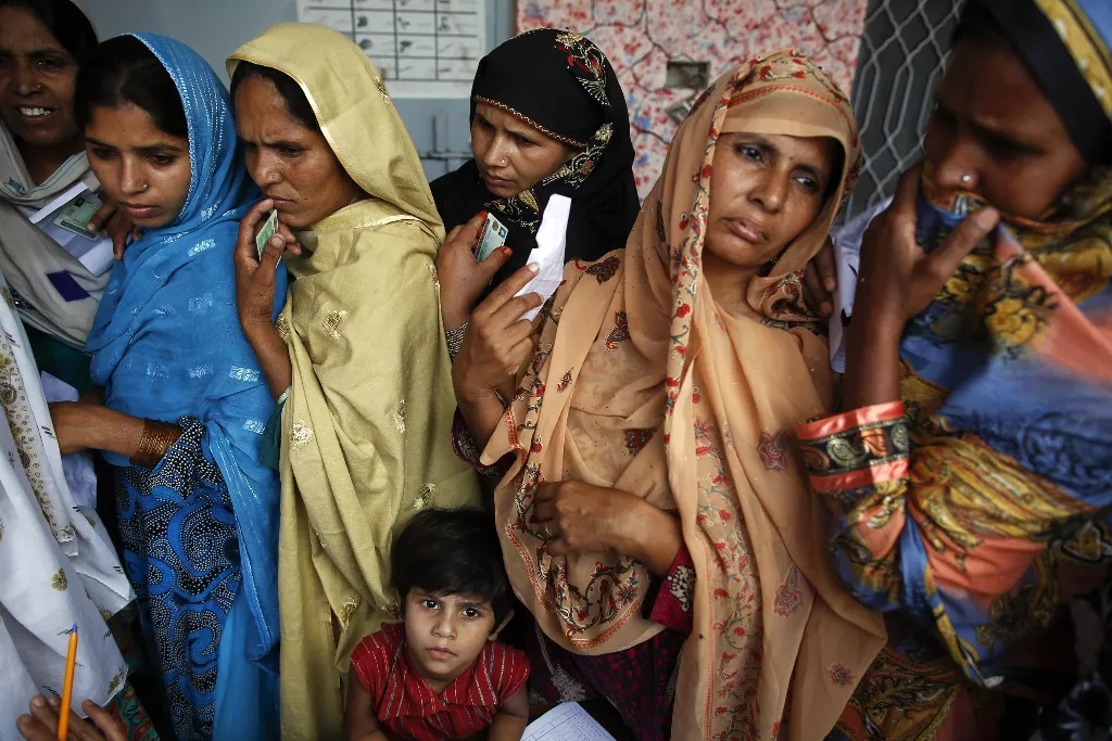 women wait to vote at a polling station in a village near lahore may 11 2013 photo reuters women wait to vote at a polling station in a village near lahore may 11 2013 photo reuters