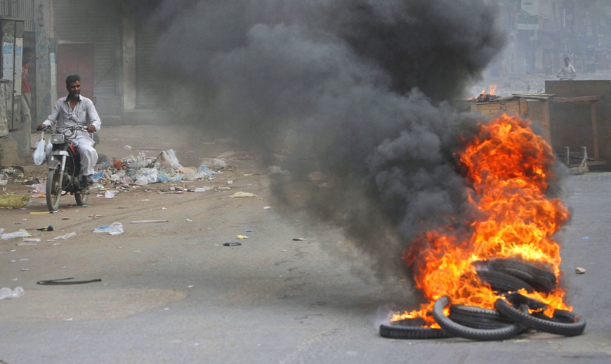 supporters of the ppp led a street protest burning tyres and blocking roads photo reuters file