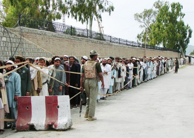 pakistani tribal voters stand in a queue as they wait for their turn to cast their votes outside a polling station in restive miranshah the main town of north waziristan photo afp pakistani tribal voters stand in a queue as they wait for their turn to cast their votes outside a polling station in restive miranshah the main town of north waziristan photo afp