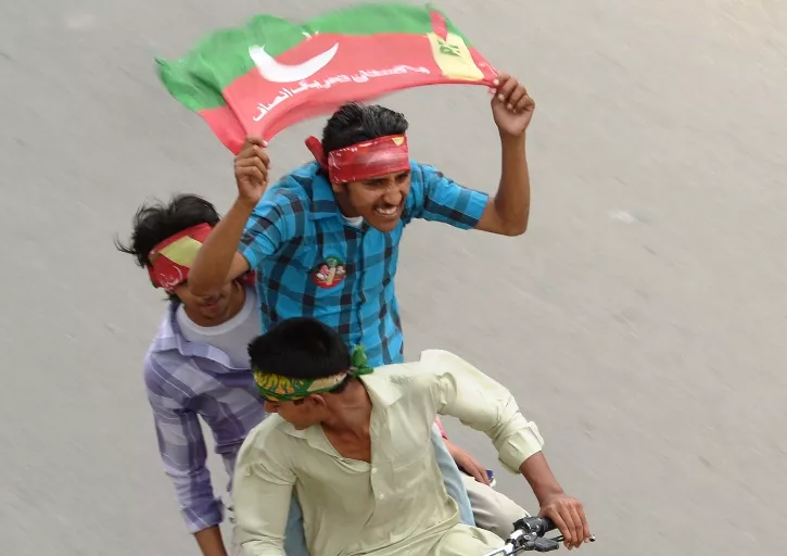 activists of pakistan tehreek e insaf pti wave party flags as they drive through the streets during the general election in rawalpindi on may 11 2013 photo afp activists of pakistan tehreek e insaf pti wave party flags as they drive through the streets during the general election in rawalpindi on may 11 2013 photo afp