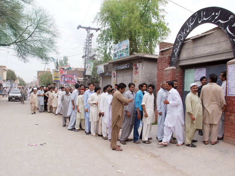 as men queue outside the government girls middle school swati gate a story begins on election day it takes us to jowgera where an elderly woman casts her vote as the day peaked around the afternoon a bomb planted on a motorcycle exploded near a women s polling station in larama charsadda road amid security concerns the pakistan army was deployed throughout the province multitudes in khyber pakhtunkhwa stamped their ballots under the presiding officers kalashi girls those with physical disabilities young old and first time voters hoping their party will rule over the next five years photos muhammad iqbal ghaffar baig and iqbal mamond