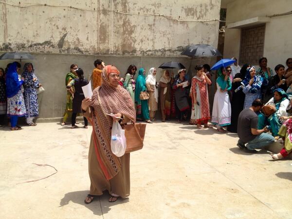 people wait in the heat to cast theire vote photo sonjawithaj1