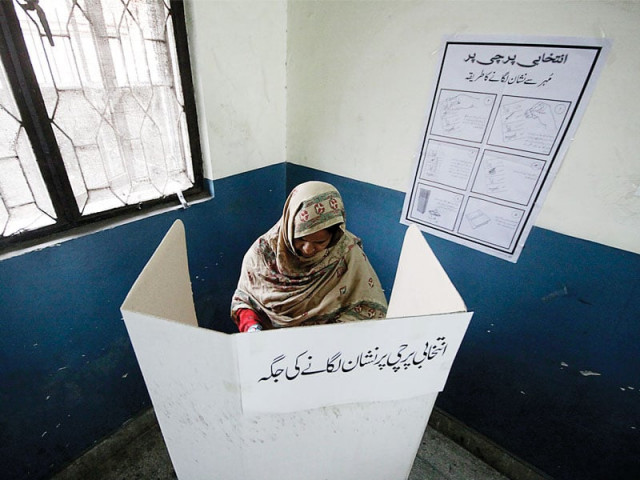 the secret ballot a woman casts her vote in na 119 the secret ballot a woman casts her vote in na 119