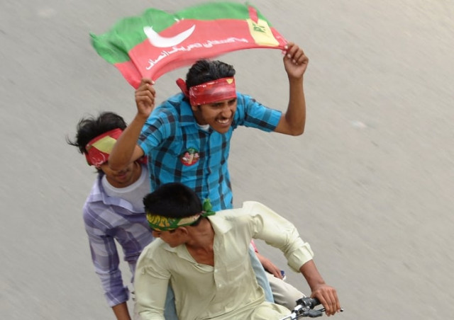 activists of pakistan tehreek e insaf pti wave party flags as they drive through the streets during the general election in rawalpindi on may 11 2013 photo afp activists of pakistan tehreek e insaf pti wave party flags as they drive through the streets during the general election in rawalpindi on may 11 2013 photo afp