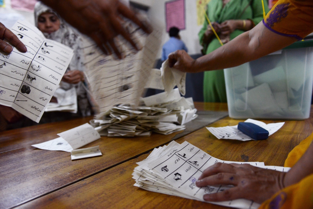 election officials count votes moments after the voting ended on may 11 2013 photo afp